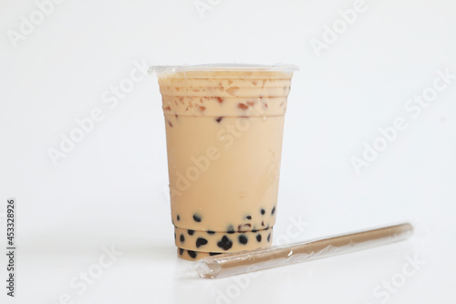 Small cup Iced milk tea Taiwan style with straw on white background, fresh cool sweet drink, food and drink concept