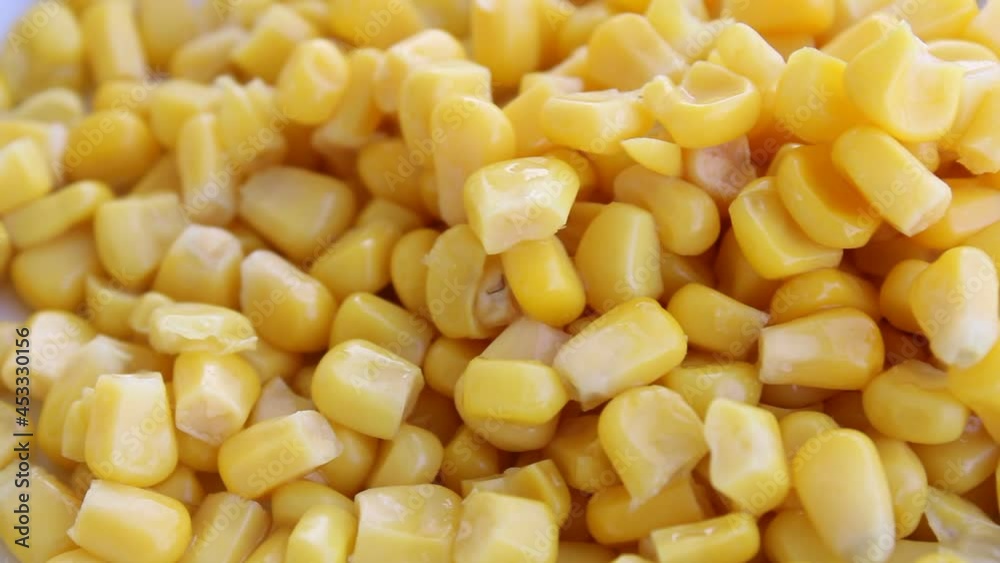 Corn kernels , close up view of cooked swet corns on a plate Corn kernels , close up view of cooked swet corns on a plate