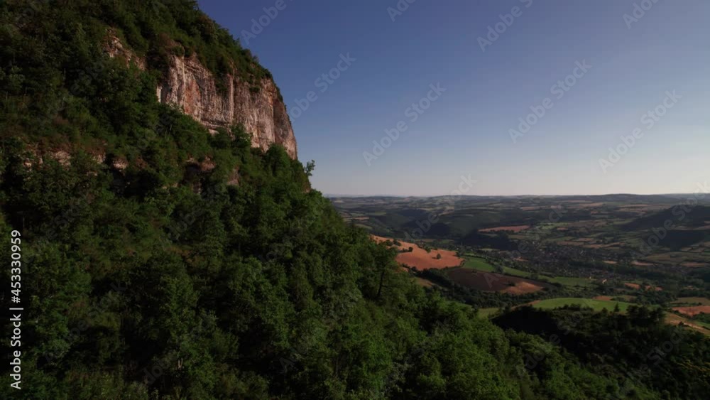Scenic View Of Countryside Landscape With Green Fields And Hills In Aveyron, France - aerial drone shot