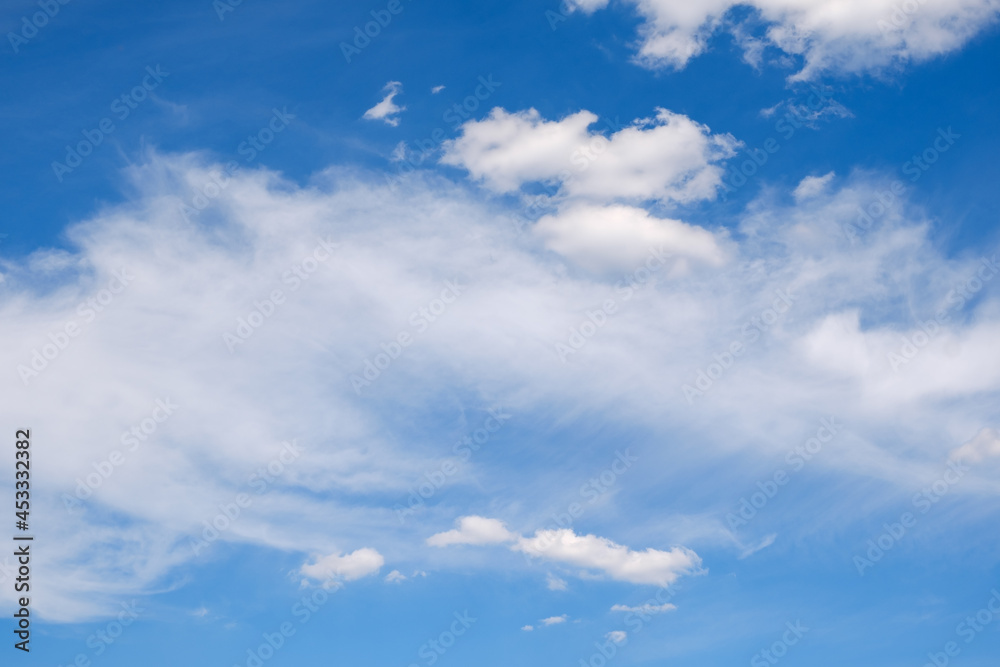 fluffy white clouds on a deep blue sky in summer
