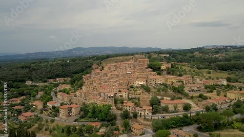 Wallpaper Mural Aerial drone view on the medieval Tuscany old town on the countryside Casale Marittimo with cypress trees and fields during a cloudy day, Pisa province, Italy Torontodigital.ca