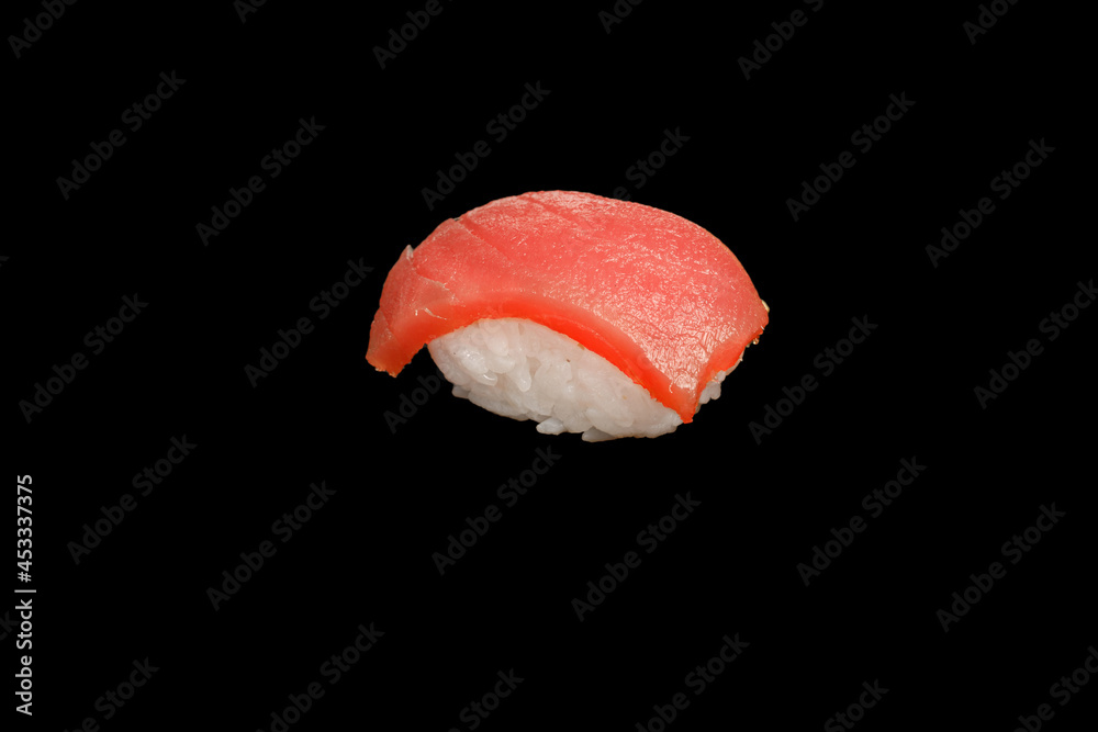 Japanese food: maki and nigiri sushi set on black background. side view composition. Japanese food: maki and nigiri sushi set on black background. side view composition.
