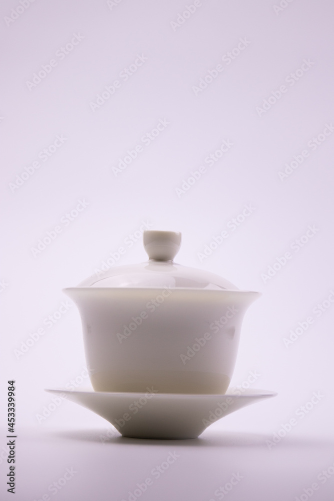 White Chinse Tea Cup with Lid on White Background White Chinse Tea Cup with Lid on White Background
