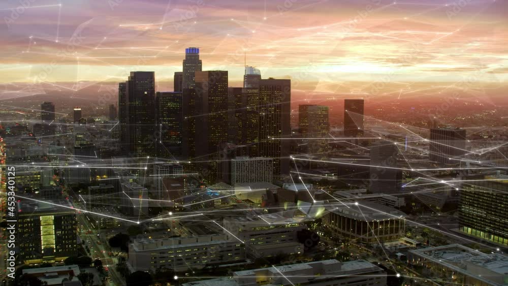 Famous Skyscrapers With Futuristic Network Over Downtown Los Angeles, California. United States. 
Aerial Connected View Of The City At Sunset.  Internet Of Things, Smart Cities, Big Data, AR.