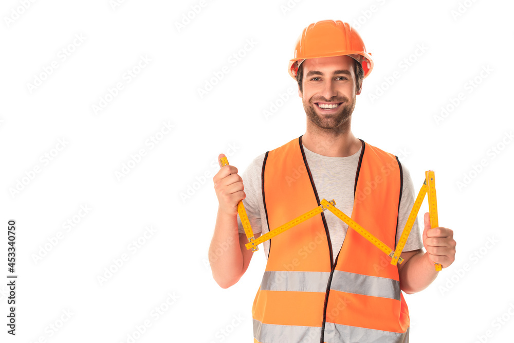 Smiling builder holding tape measure isolated on white Smiling builder holding tape measure isolated on white