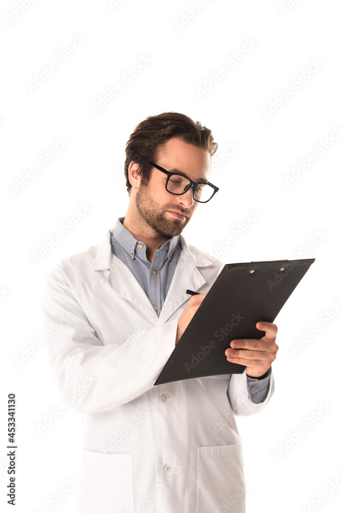 Doctor in eyeglasses writing on clipboard isolated on white Doctor in eyeglasses writing on clipboard isolated on white