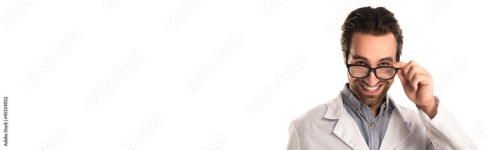 Young doctor holding eyeglasses and smiling isolated on white, banner Young doctor holding eyeglasses and smiling isolated on white, banner