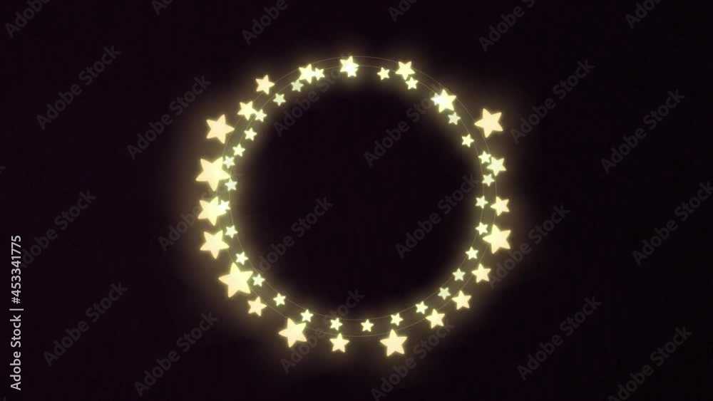 Yellow glowing star shaped decorative fairy lights against black background Yellow glowing star shaped decorative fairy lights against black background