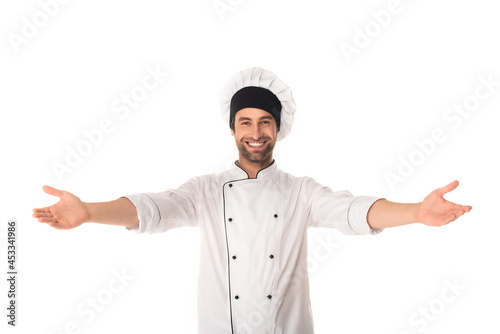 Happy chef with outstretched hands looking at camera isolated on white