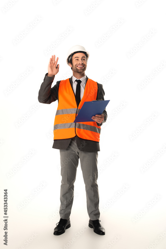 Smiling architect with clipboard waving hand on white background Smiling architect with clipboard waving hand on white background