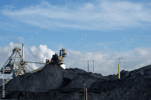 Huge mountains of coal are necessary to keep the kilns burning at Tata Steel. Wijk aan Zee, Noord-Holland province, The Netherlands photo