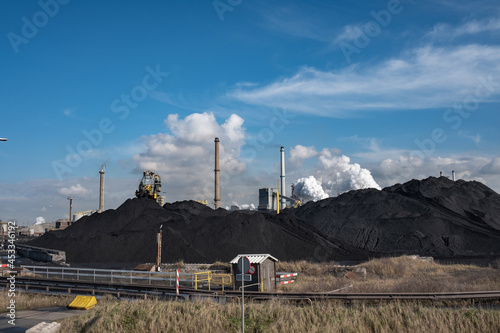 Huge mountains of coal are necessary to keep the kilns burning at Tata Steel. Wijk aan Zee, Noord-Holland province, The Netherlands photo