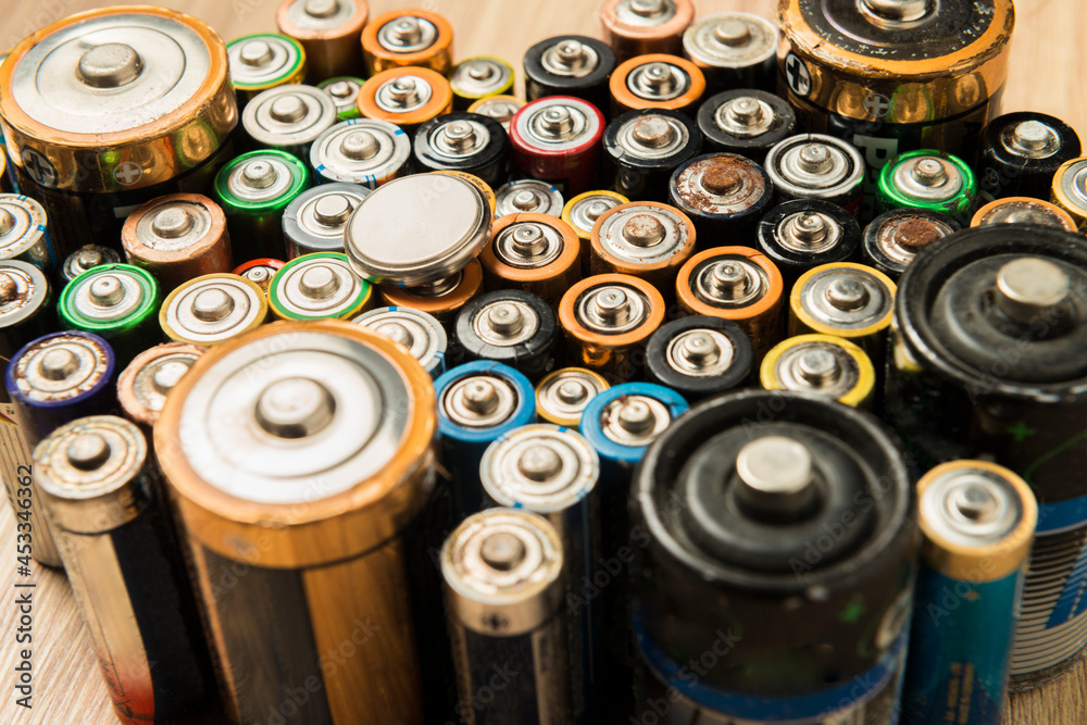 Discharged batteries placed neatly on a table. Discharged batteries placed neatly on a table.