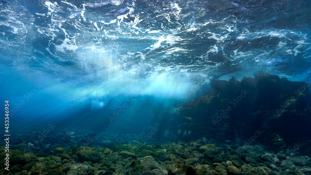 Fototapeta premium Rays of sunlight over the reef underwater