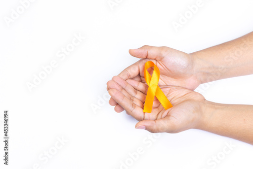 two hands holding orange ribbon, kidney cancer, white background