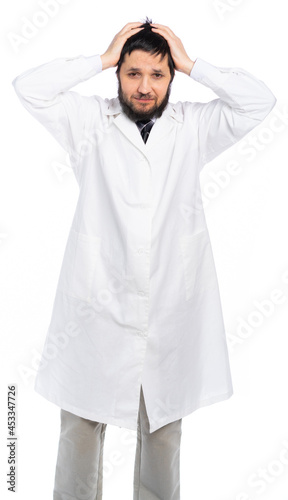 a doctor in a white coat grabbed his head, a mistake in the diagnosis. isolated, white background