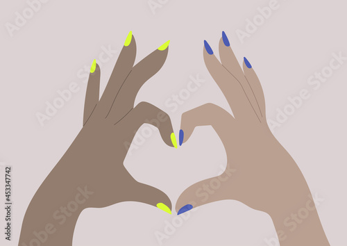A diversity concept, two hands form a heart sign with their fingers