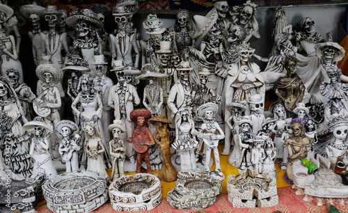 Tablou pe pânză Skulls, some representing Our Lady of the Holy Death or Santa Muerte, a Mexican deity, are seen for sell in a street stall of Chapultepec public park, Mexico City, Mexico