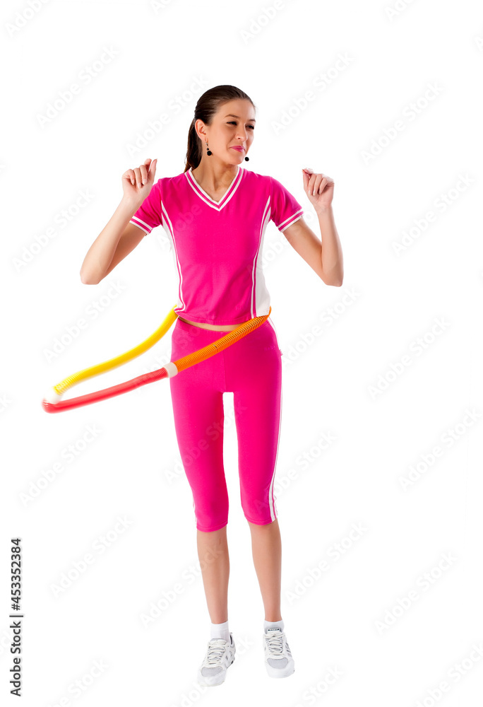 Young pretty woman in sport suit with hula hoop
