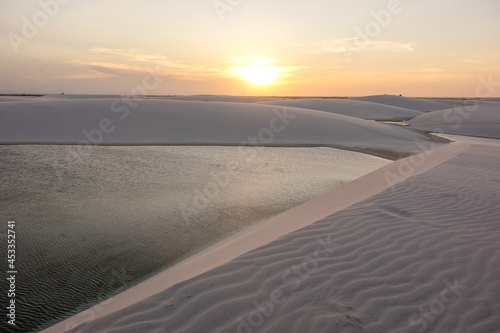 sunset over Lencois Maranhenses national park  Brazil. Dunes and lagoons  paradise tourist destination