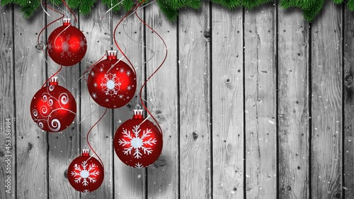 Animation of christmas baubbles over wooden background photo