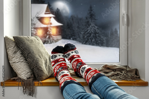 Woman legs with christmas socka and free space for your decoration  photo