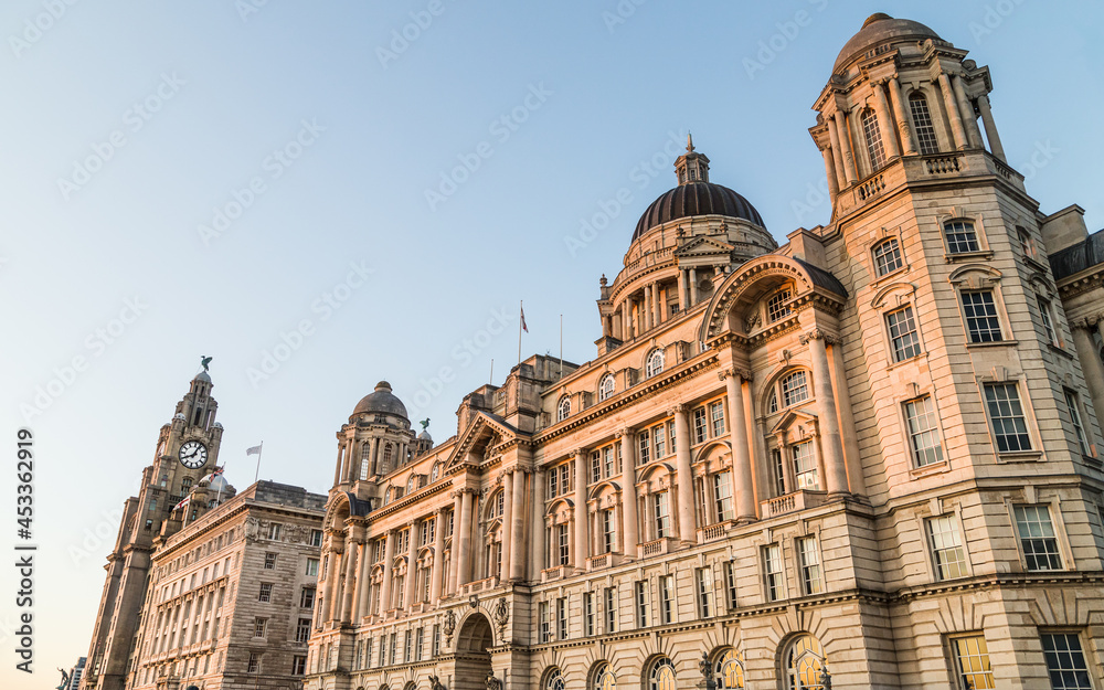 Three Graces bathed in golden light