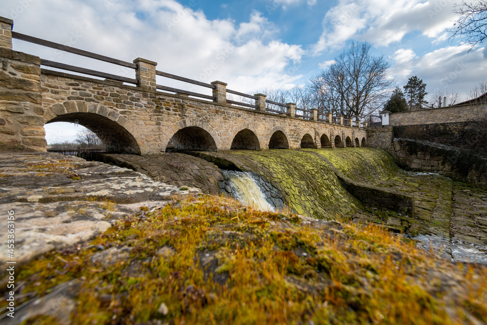 Bridge and river Rokytka in Dolni Pocernice, Prague, Czech republic