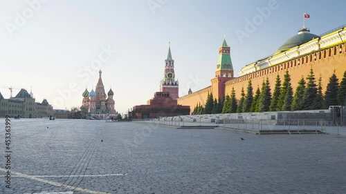walking at Red Square in Moscow. St. Basil’s Cathedral, Spasskaya Tower and the mausoleum, Russia