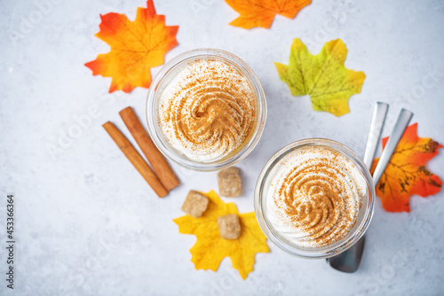 Pumpkin spiced Latte Coffee with whipped cream in a glass