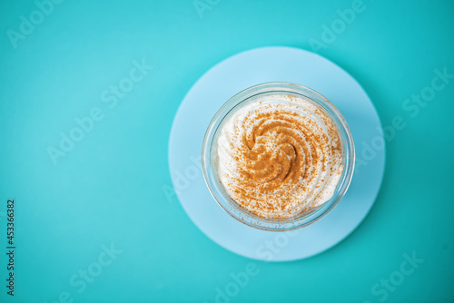 Pumpkin spiced Latte Coffee with whipped cream in a glass