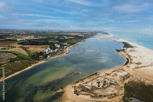 Aerial view of Praia da Fabrica, also known as Praia de Cacela Velha beach, a sandy barrier island at the mouth of the Ria Formosa in the Algarve region of mainland Portugal