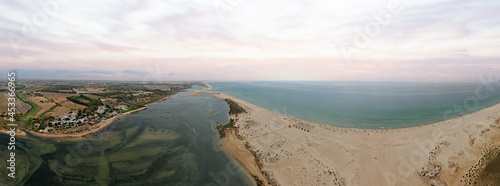 Panoramic aerial view of Praia da Fabrica, also known as Praia de Cacela Velha beach, a sandy barrier island at the mouth of the Ria Formosa in the Algarve region of mainland Portugal