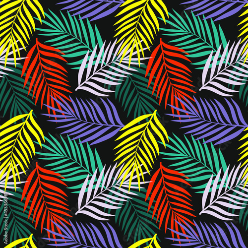 Palm leaves of different bright colors on a black background. Tropical background theme. Seamless pattern for any use.