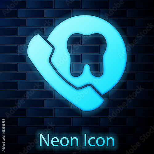 Glowing neon Online dental care icon isolated on brick wall background. Dental service information call center. Vector