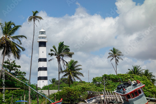 Mandacaru lighthouse and boats in the small village in Barreirinhas, Maranhao, Brazil photo