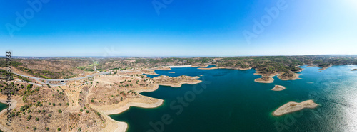 Fototapeta Naklejka Na Ścianę i Meble -  The Odeleite Dam, located in the municipality of Castro Marim in the Algarve, was built on the River Odeleite, which rises in the uplands of the Serra do Caldeirão and flows into the Rio Guadiana