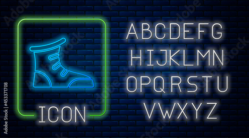 Glowing neon Sport boxing shoes icon isolated on brick wall background. Wrestling shoes. Neon light alphabet. Vector