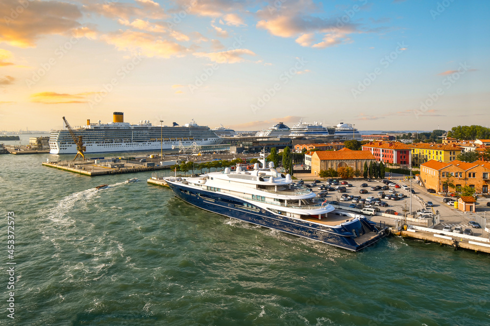 Late afternoon, early evening view of the Venice cruise port with at least five large cruise ships in port, Venice, Italy.