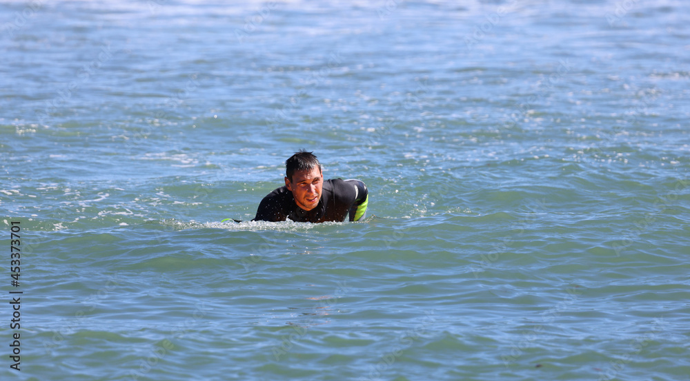 Surfer resting in the  ocean