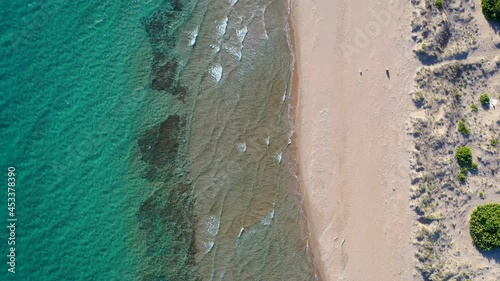 High angle view of Chalikounas beach on a land strip between Lake Korission and Ionian Sea on Corfu Island in Greece, 4k video photo