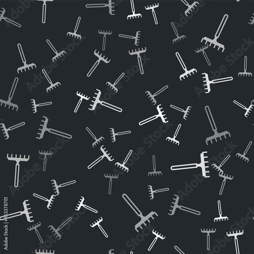Grey Garden rake icon isolated seamless pattern on black background. Tool for horticulture, agriculture, farming. Ground cultivator. Housekeeping equipment. Vector
