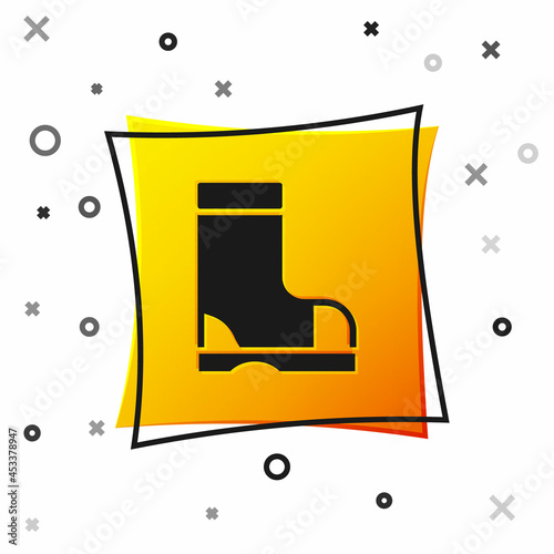 Black Waterproof rubber boot icon isolated on white background. Gumboots for rainy weather, fishing, gardening. Yellow square button. Vector