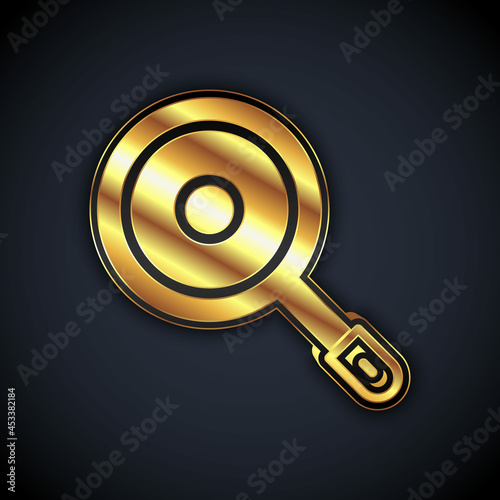 Gold Frying pan icon isolated on black background. Fry or roast food symbol. Vector
