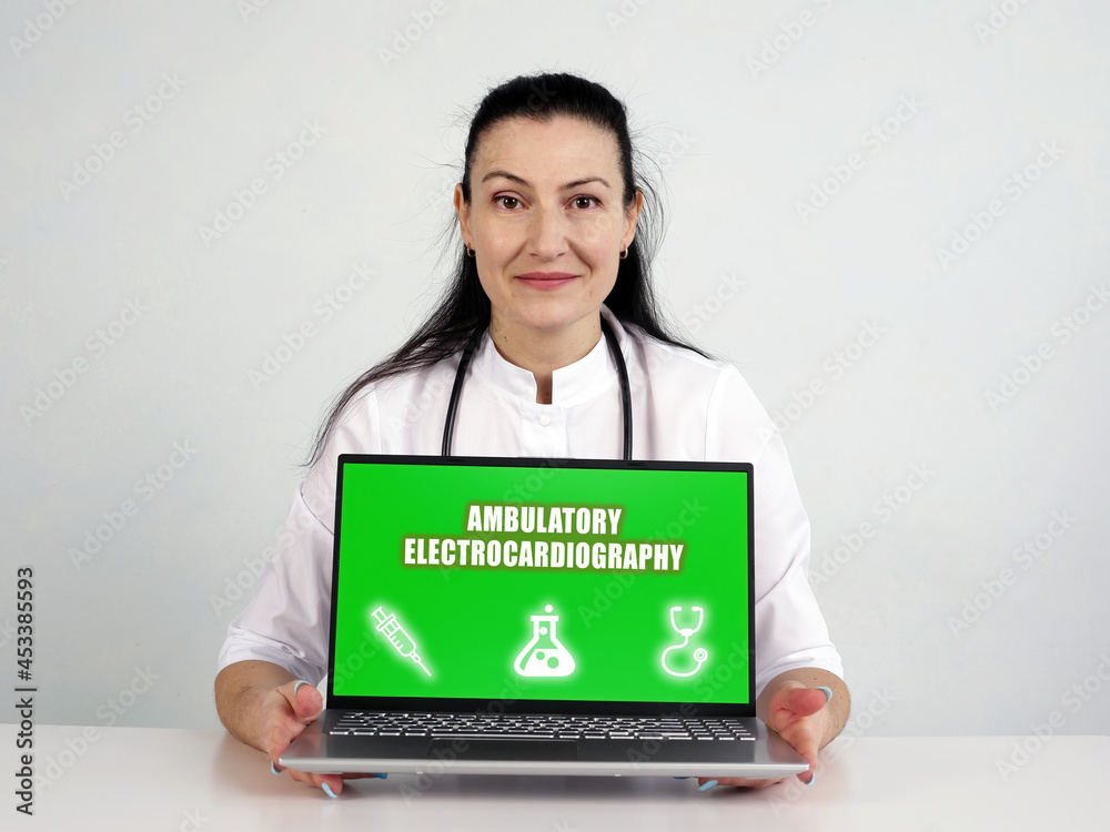 AMBULATORY ELECTROCARDIOGRAPHY text in search line. therapist looking for something at computer. AMBULATORY ELECTROCARDIOGRAPHY text in search line. therapist looking for something at computer.