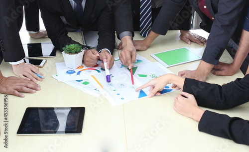 Business People Analyzing Statistics Financial Concept or Business People Meeting Conference Discussion Corporate Concept or Teamwork with business people analysis cost graph on desk at meeting room.