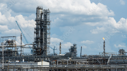 Industrial view at oil refinery plant form industry zone with cloudy sky. Industry concept.