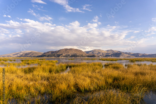 Lake Titicaca is a lake between Peru and Bolivia. It is the highest lake in the world available for transportation.