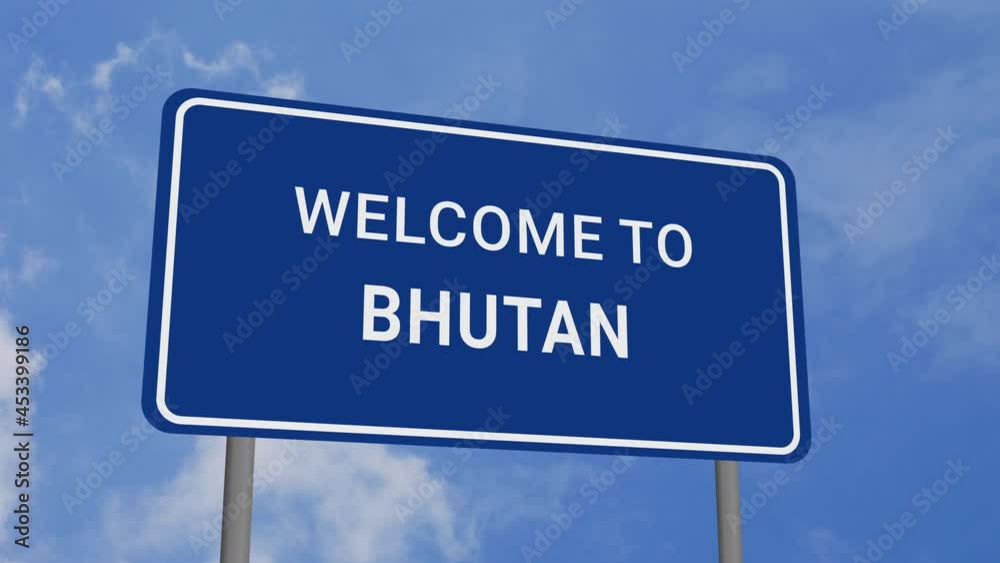 Welcome to Bhutan Road Sign on Clear Blue Sky with Rapid Moving Clouds Welcome to Bhutan Road Sign on Clear Blue Sky with Rapid Moving Clouds