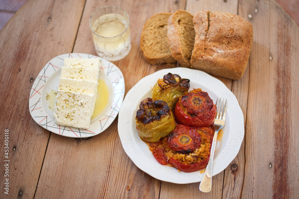 Greek traditional food Gemista already cooked in the oven. Stuffed peppers, tomatoes, zucchini with rice, vegetables, herbs and sometimes minced meat
